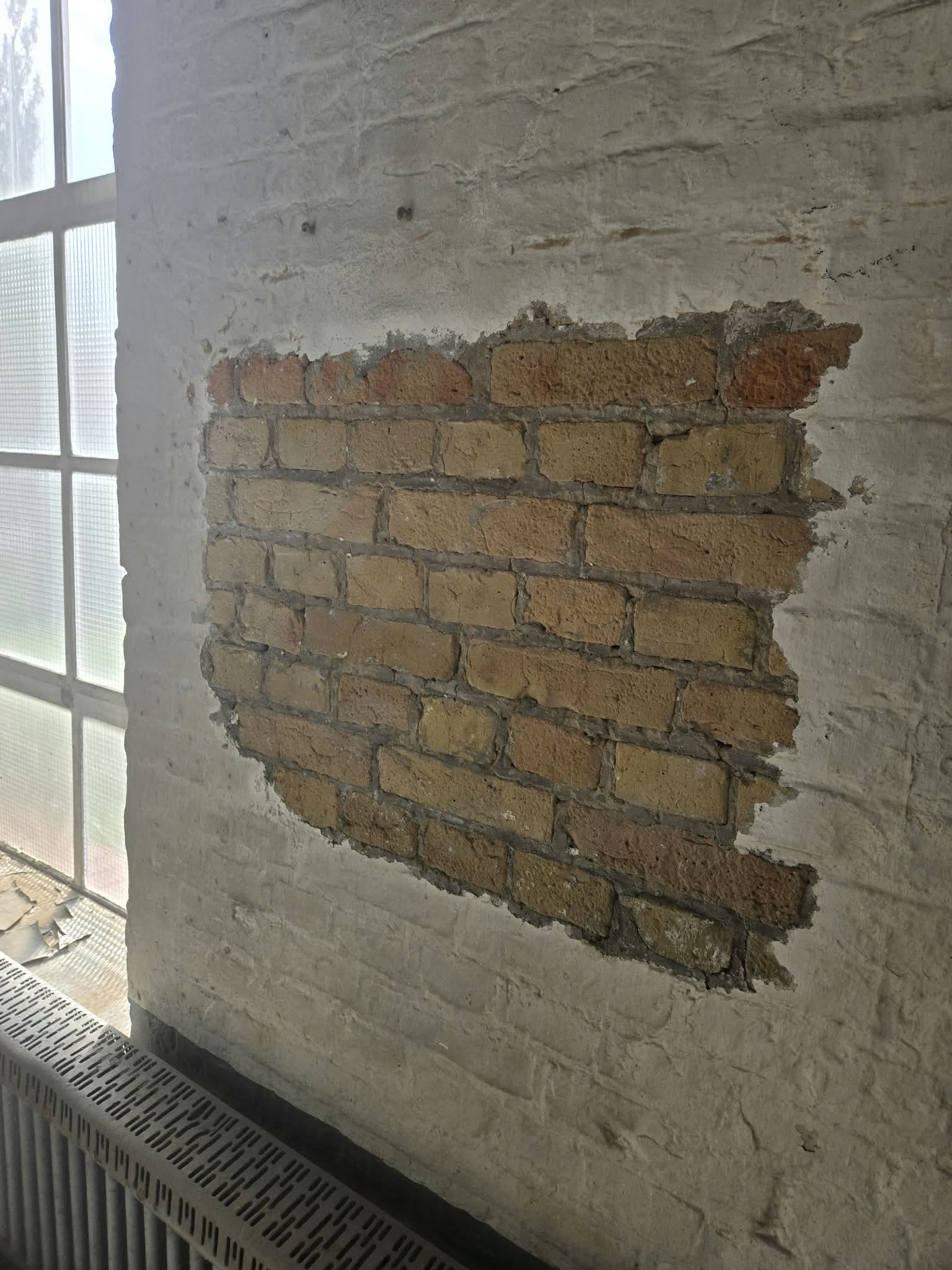 Brick wall paint removal completed by dry ice blasting